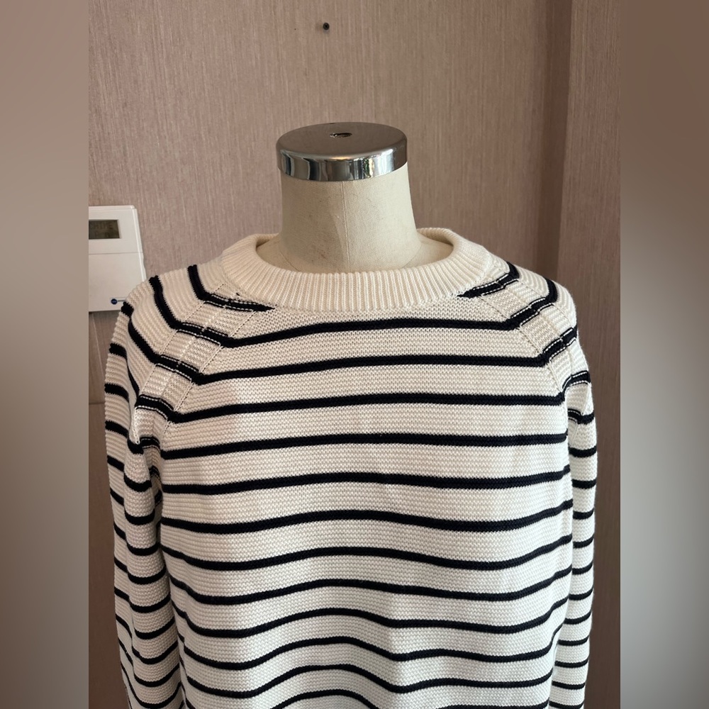 Cream and dark blue striped sweater.